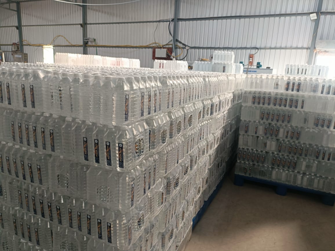 Pallets of Aqua Dein bottled water ready for dispatch
